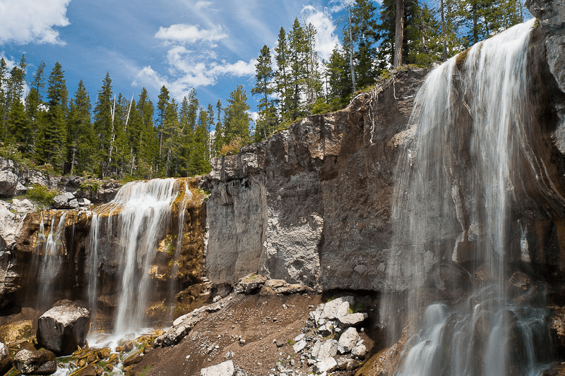 Paulina Falls, an 80-foot twin waterfall plunging over volcanic cliffs in Newberry National Volcanic Monument near Bend