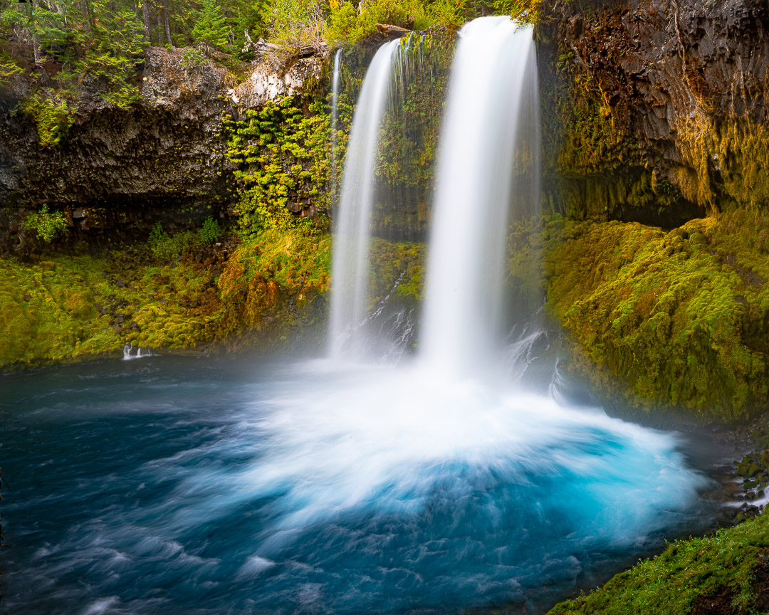Sahalie Falls, a 100-foot cascade of foaming white water on the McKenzie River framed by old-growth conifers
