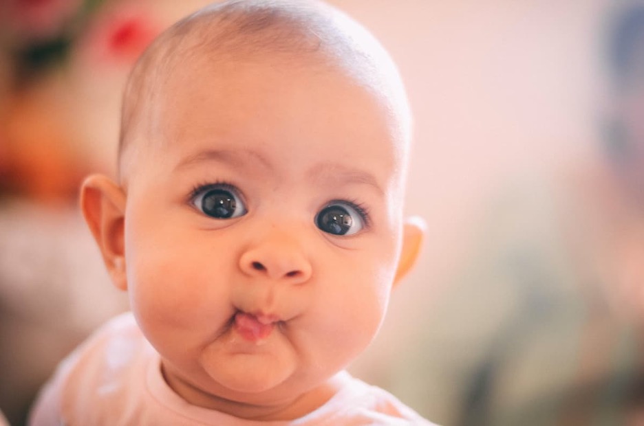 Close up of a baby with chubby cheeks