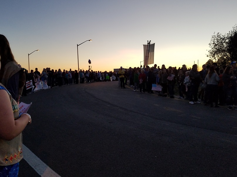 A huge crowd lined the road where a parade of veterans would lead them to a welcoming ceremony.