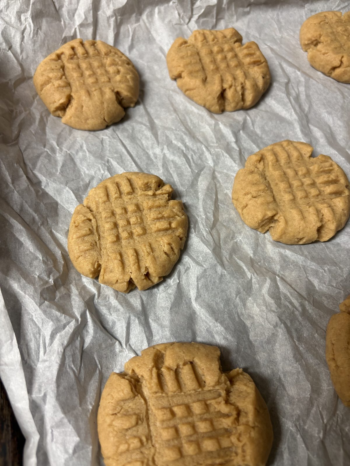 sourdough brown butter peanut butter cookies on a sheet pan