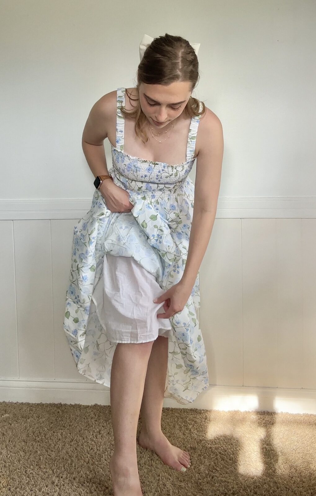 The Anjuli Nap Dress from Hill House, worn by Lindsay. She's pulled the skirt up to reveal the inner double lining.