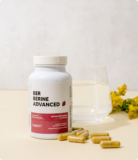 bottle of berberine next to glass of water