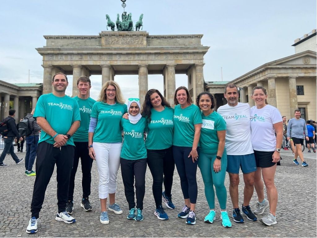 Ovarian cancer caregivers and survivors pose at Team Teal endurance event