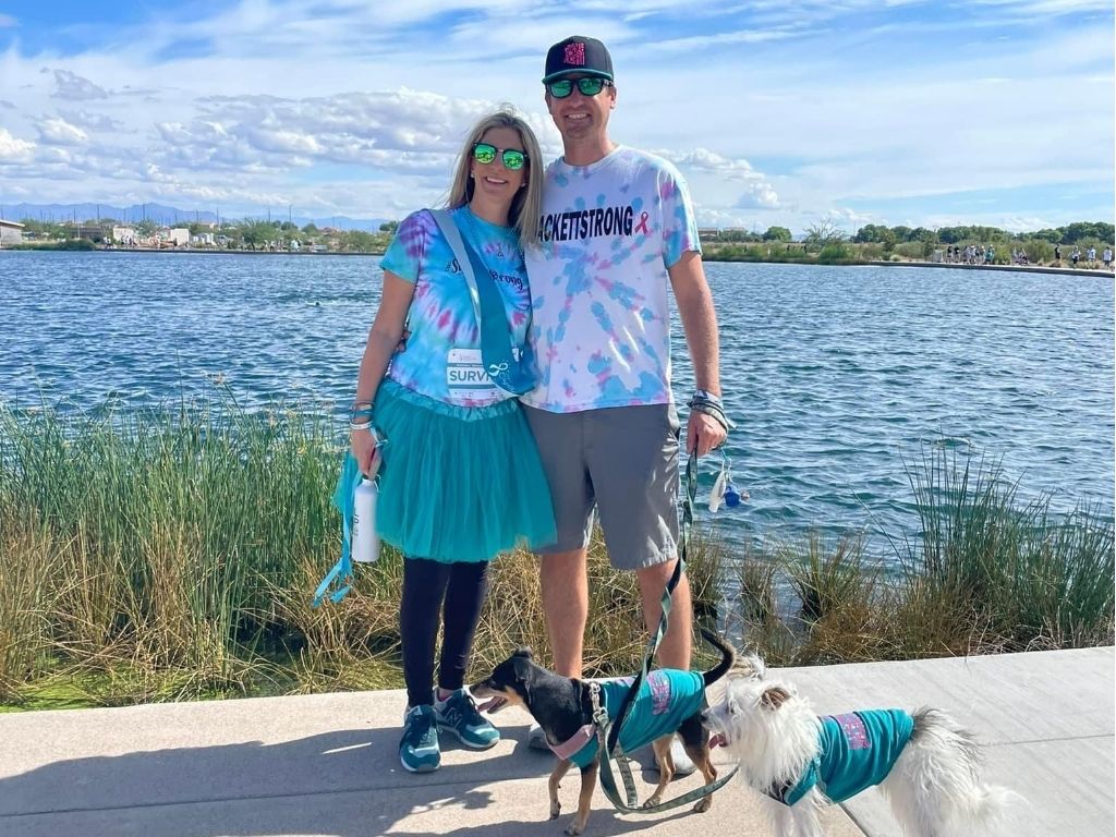 Ovarian cancer caregiver poses with wife at National Ovarian Cancer Coalition's Together in TEAL Run/Walk