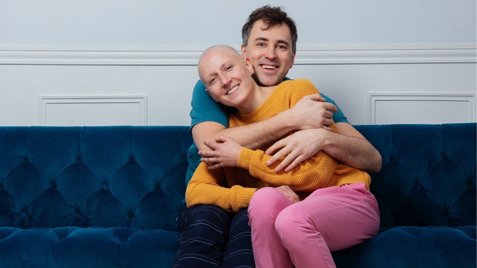 Ovarian cancer survivor embraced by spouse