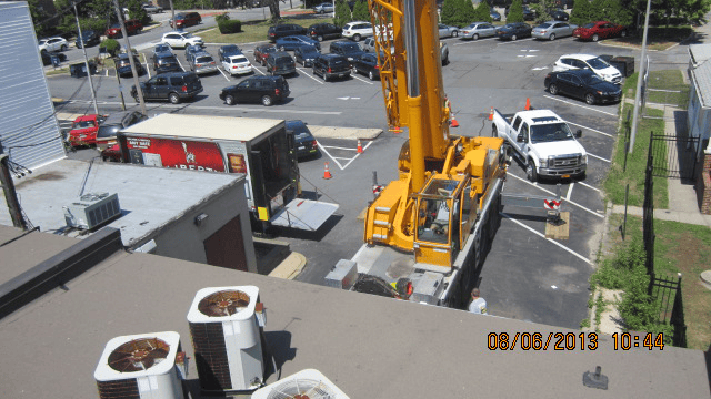 Challenging safe removal from room with use of a crane
