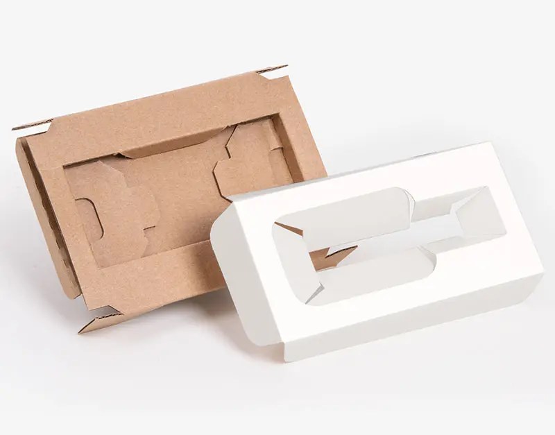paperboard and corrugated cardboard box inserts shown with custom cut shapes for product fit