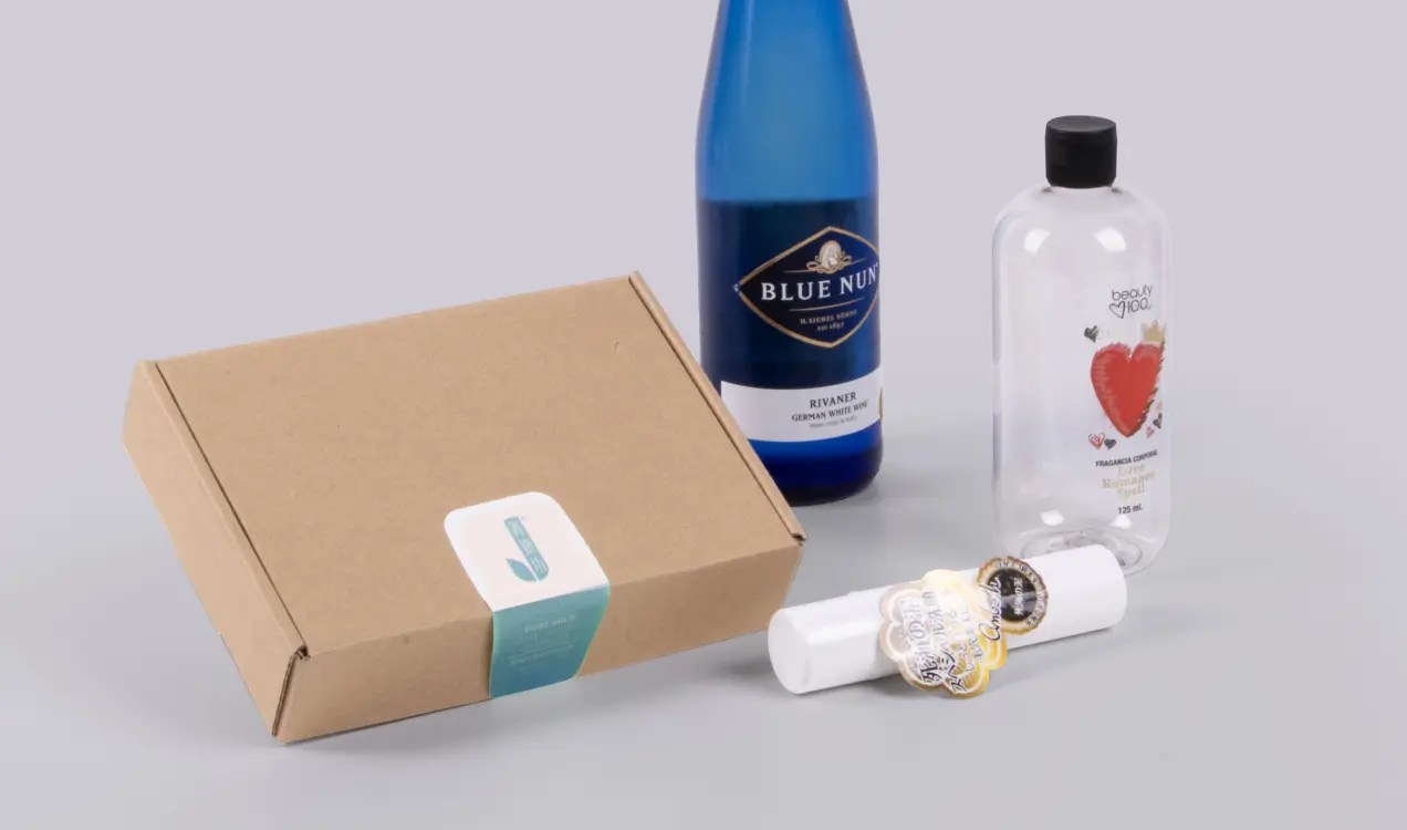 Custom printed labels applied on bottles and packaging boxes for branding