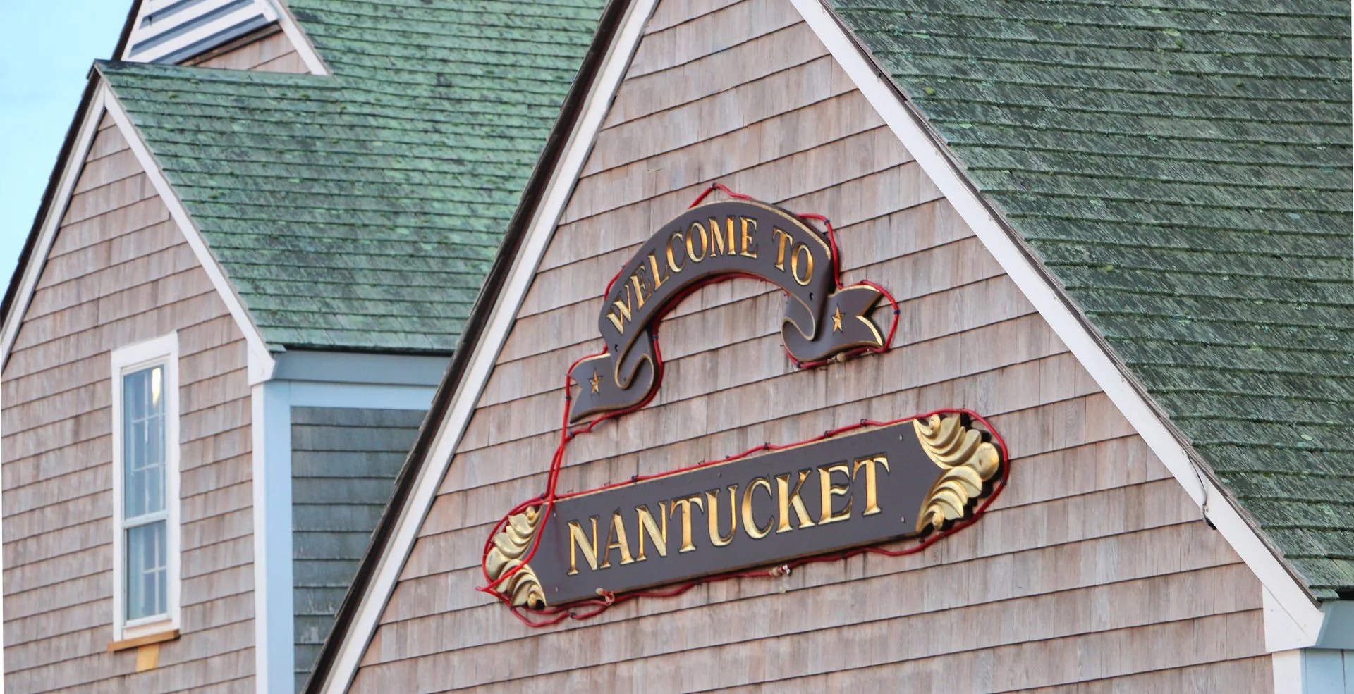 Welcome to Nantucket sign on building