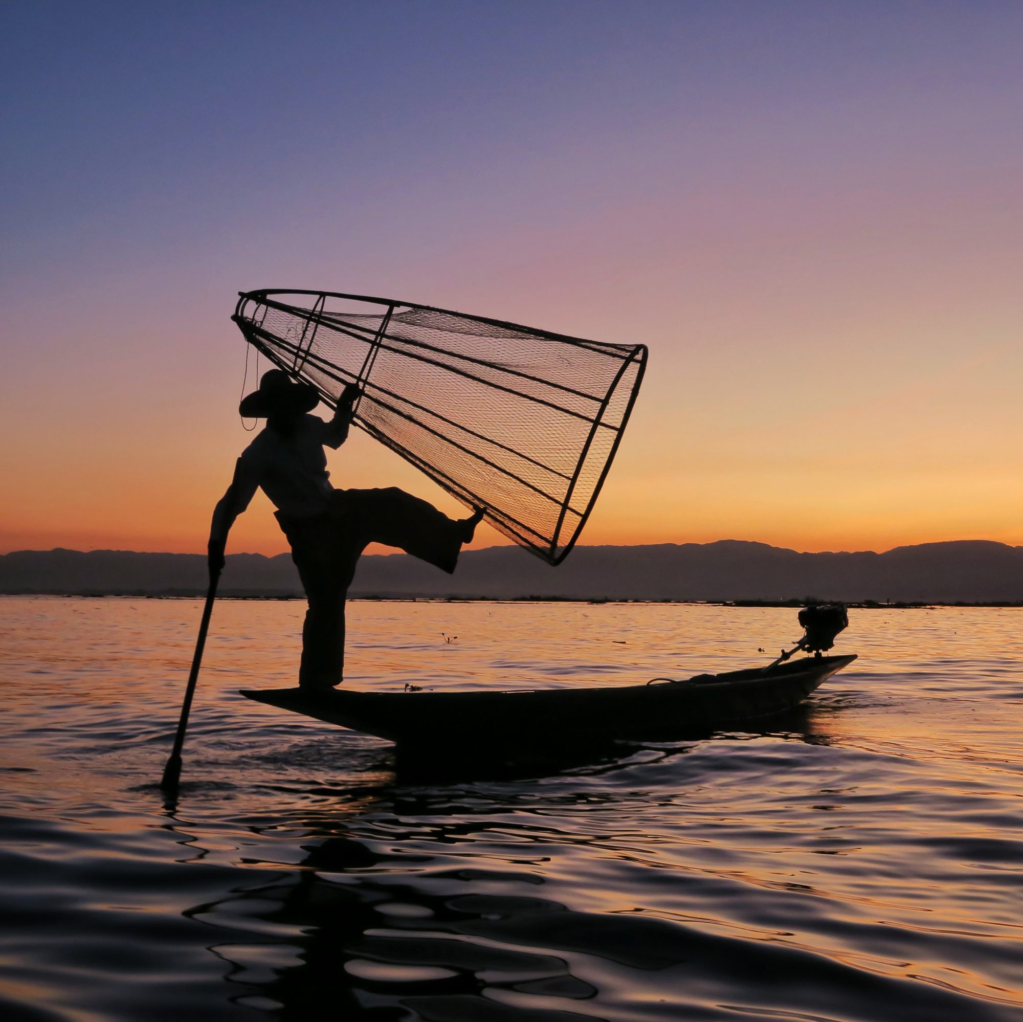 Fisherman posing in sunset