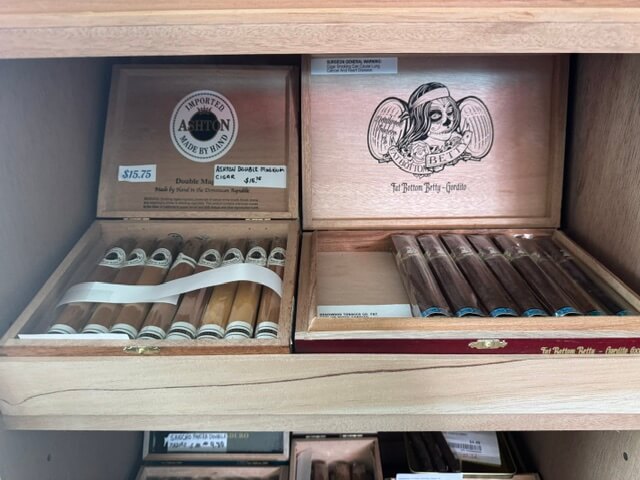 A box of Ashton Double Magnum Cigars, and a box of Deadwoods's Fat Bottom Betty's in a humidor for sale in Pagosa Springs Colorado.