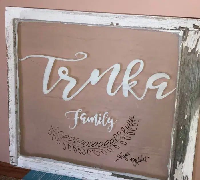 vintage barn window craft with family name painted on it