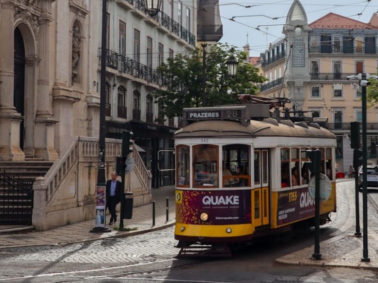Tram 28 travelling through Lisbon's historic centre