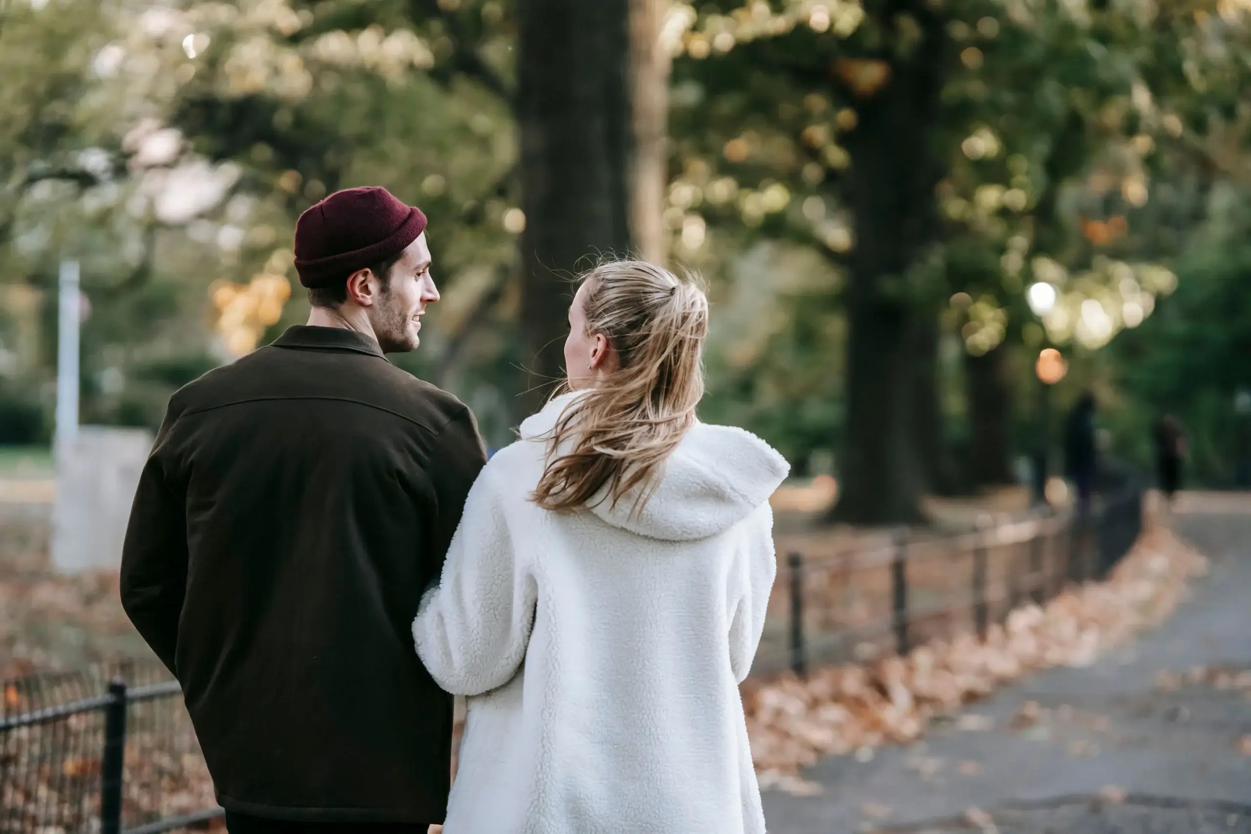 Couple walking together while discussing their relationship