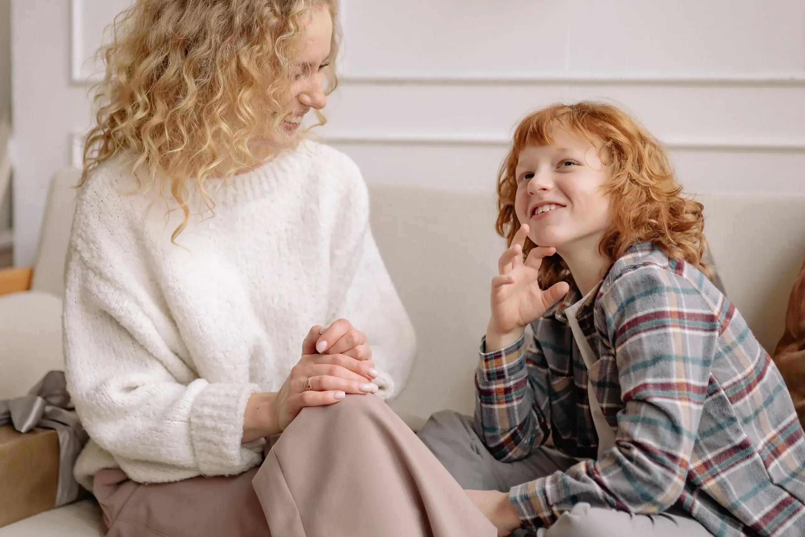 Parent and child talking together, representing developmental grace and healthy emotional support.