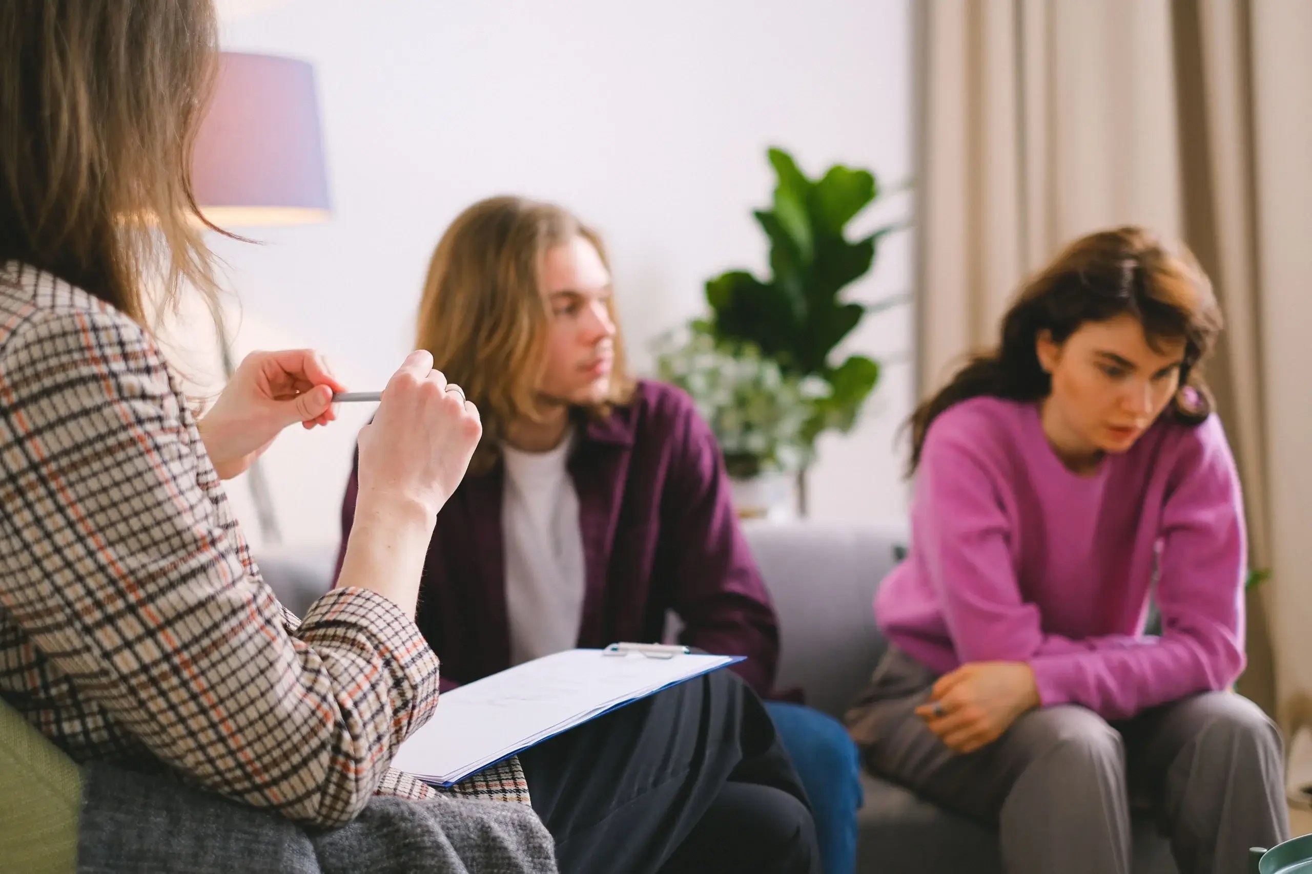 Therapist speaking with a couple during a counseling session