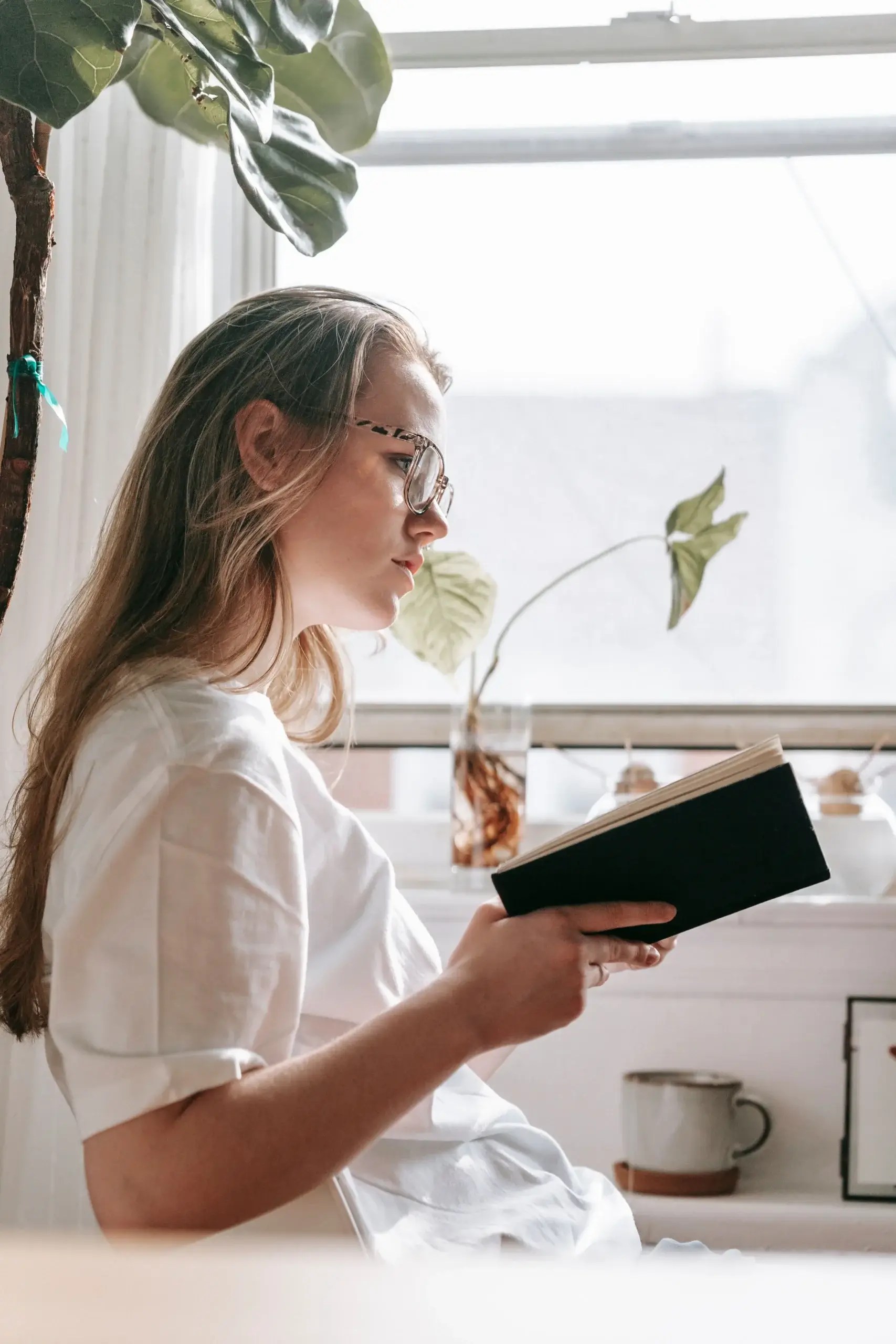 Woman reading and reflecting on emotions during therapy