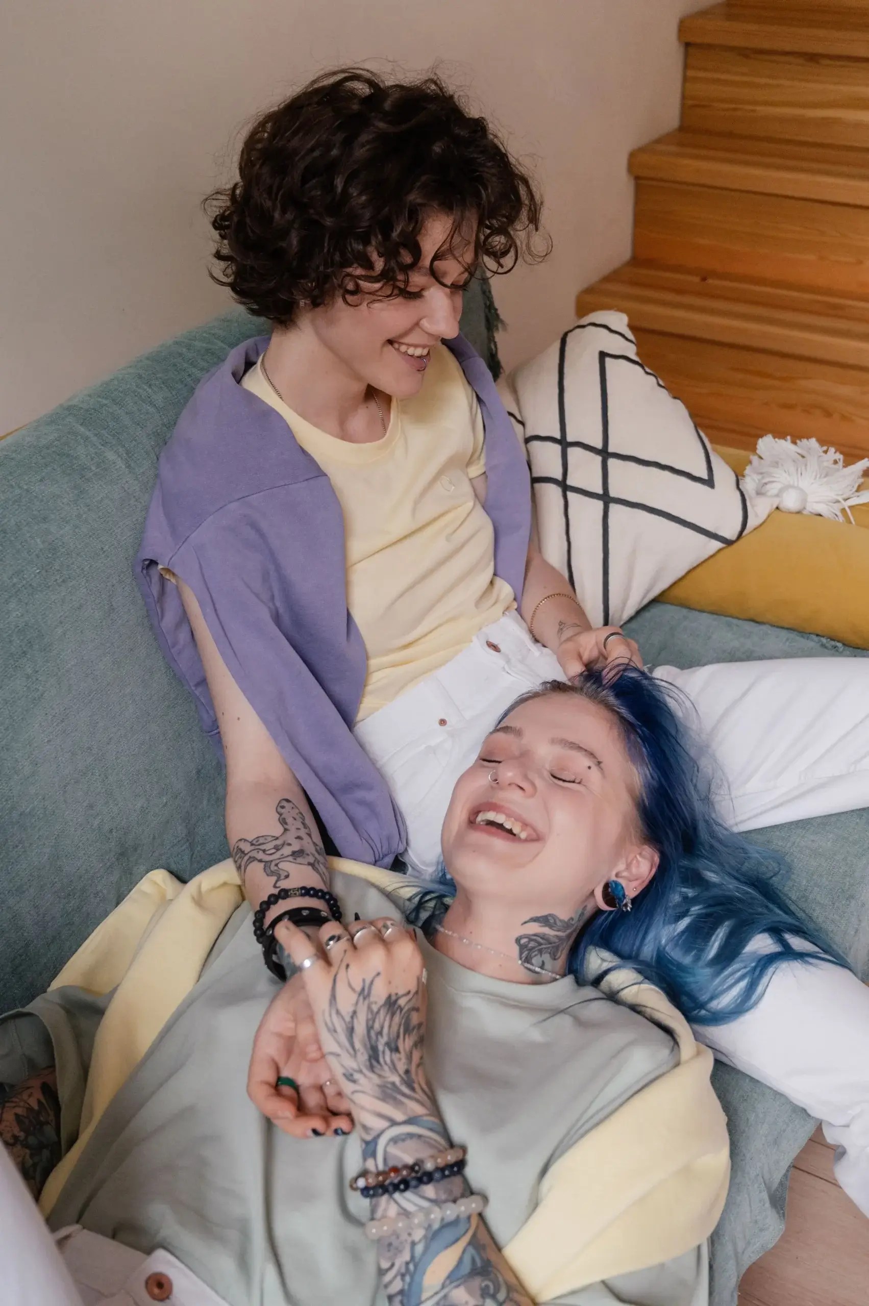 LGBTQIA+ couple sharing a joyful moment together at home