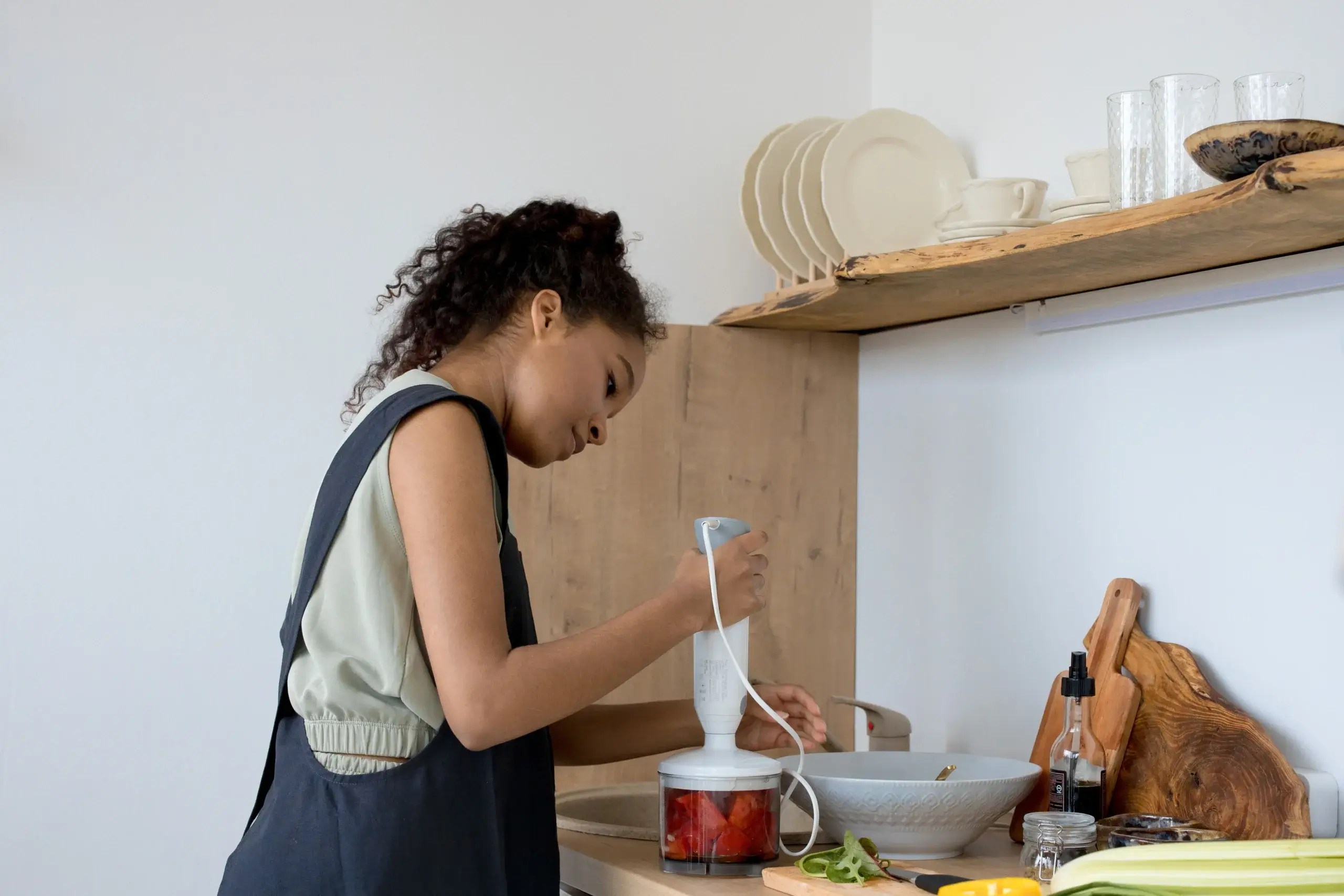 Child helping prepare food in the kitchen