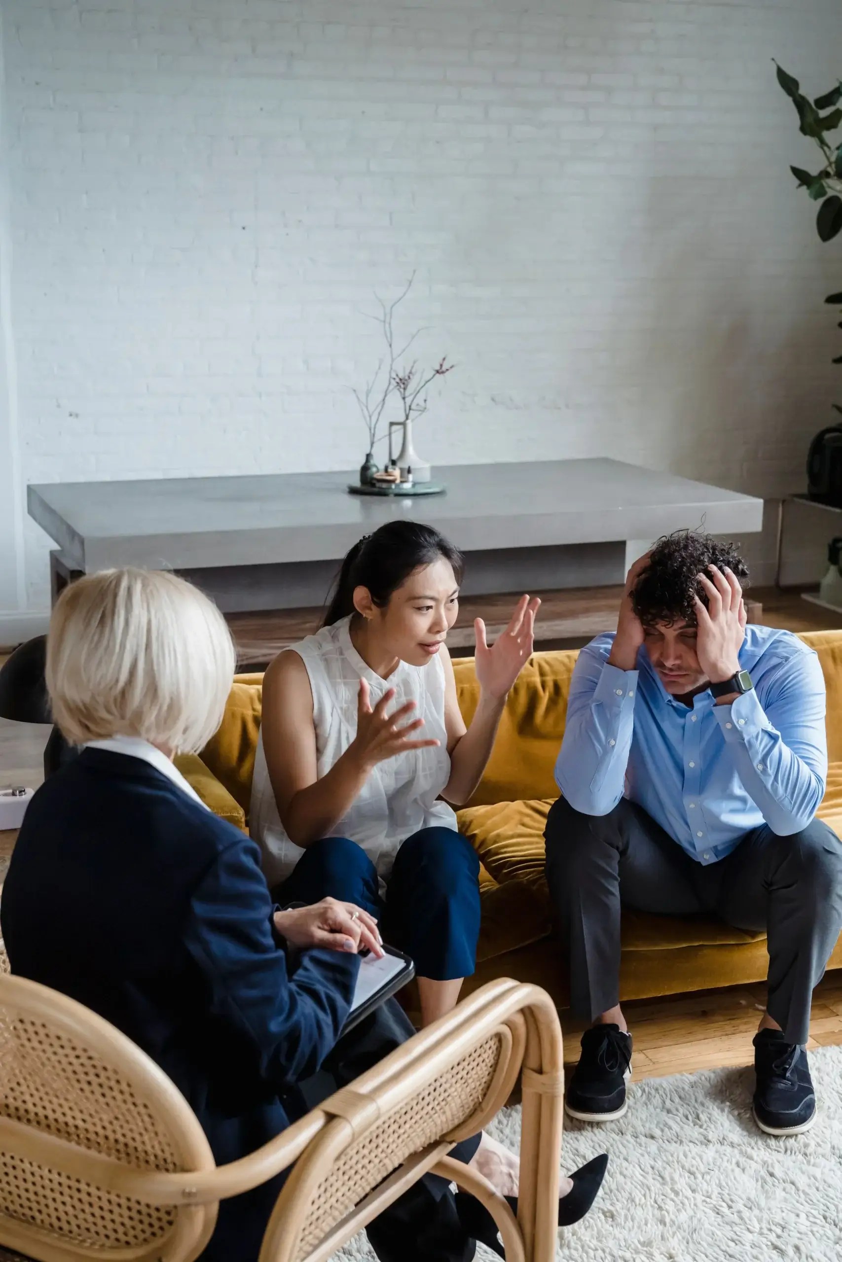 Therapist speaking with a distressed couple during a counseling session