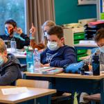 An unvaccinated teacher spread COVID-19 to 50% of students in a classroom after she took off a mask to read