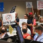 Adults laughed at a teen who was talking at a Tennessee school-board meeting about his grandmother dying of COVID-19, video shows