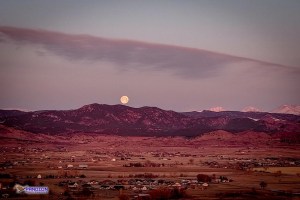 Photo taken by Pandion Property Inspections, LLC using a drone of full moon setting over Rocky Mountains