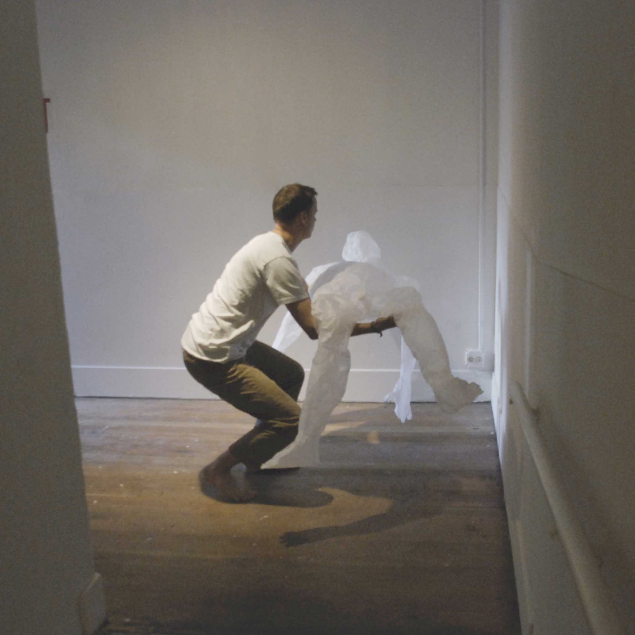 Incline Gallery is a space made up of three long ramps that were formerly used to push bodies up to a morgue on the second floor. For this performance, I carry a negative version of myself through the gallery and set it afire at the top.