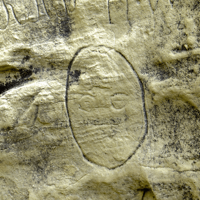 One of the first inscriptions you see is this little face.