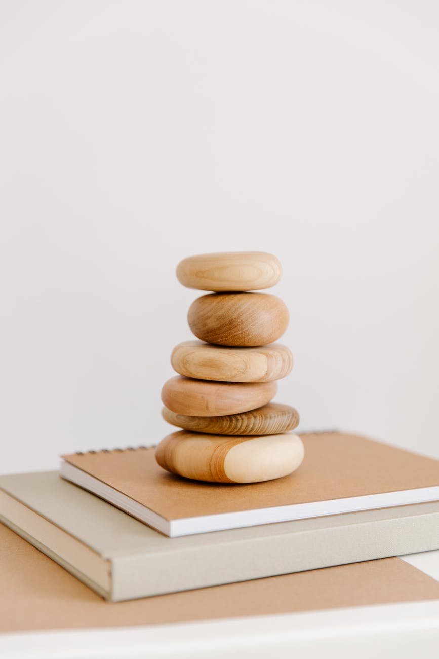 brown wooden chess piece on white book