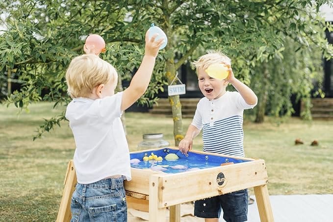 Kids having fun water table