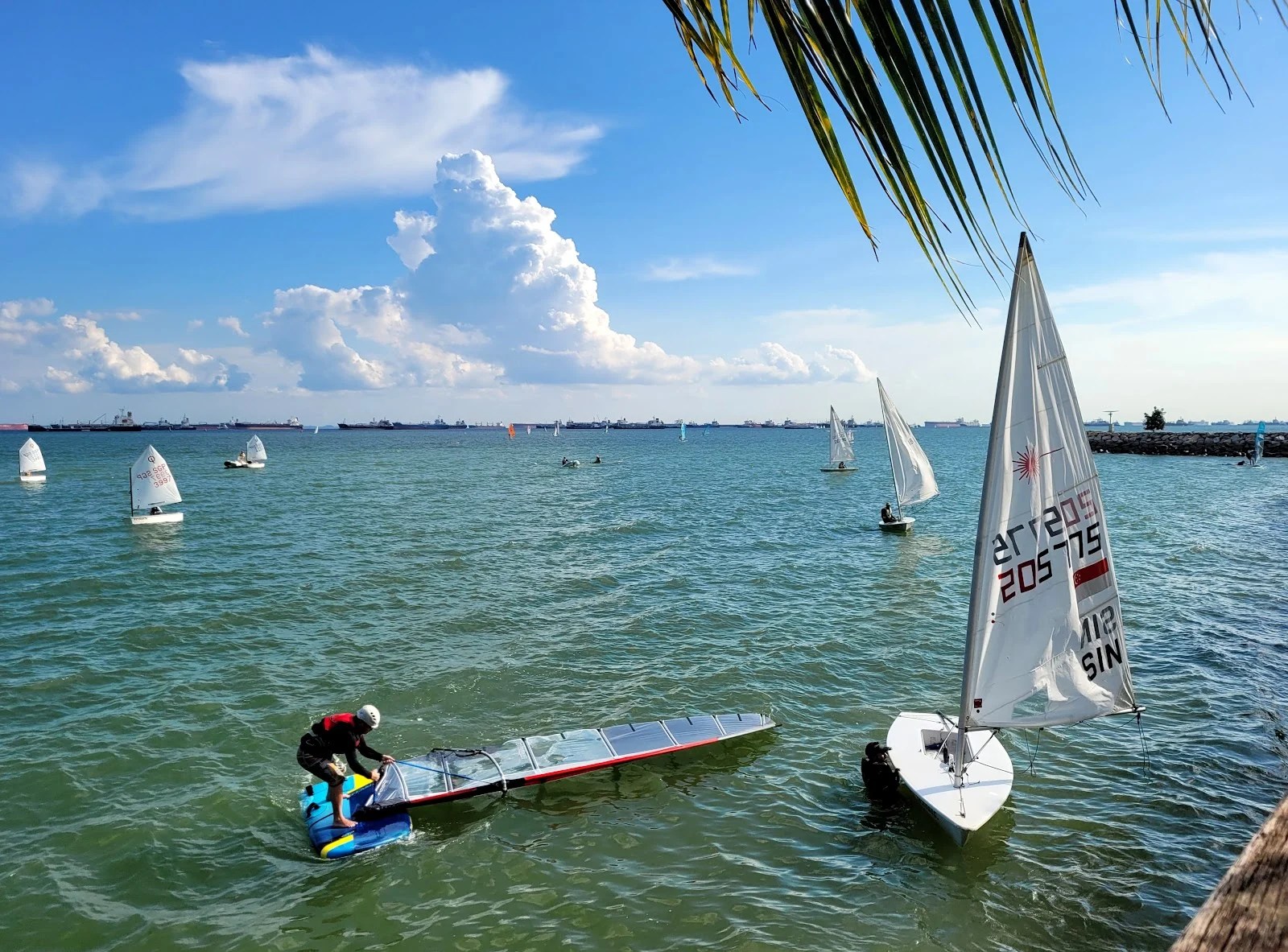 Sailboats and water sports gear at Constant Wind