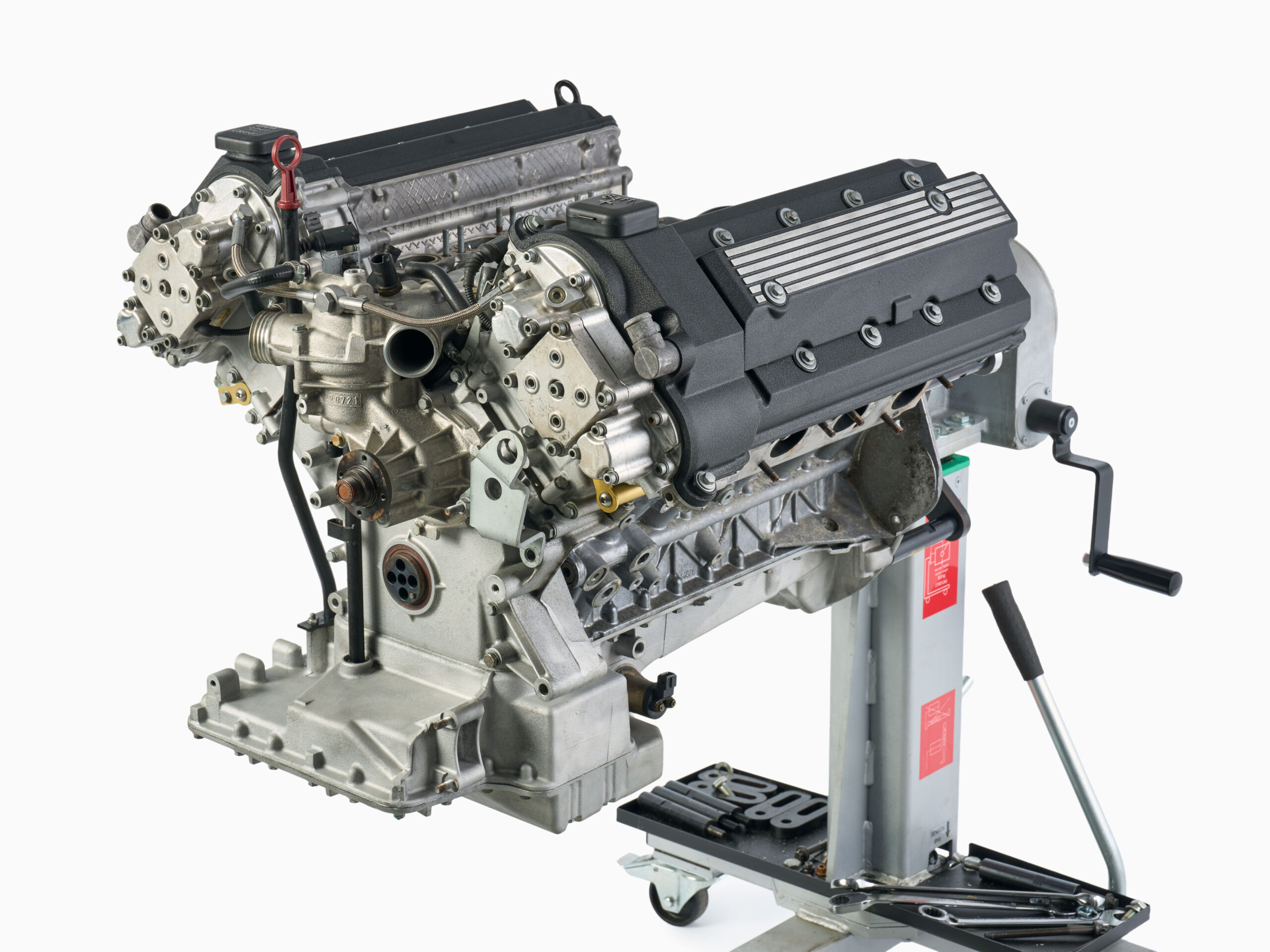 BMW S62 engine longblock on stand with rebuilt internals, wrinkle black valve covers, and bead-blasted aluminum covers.