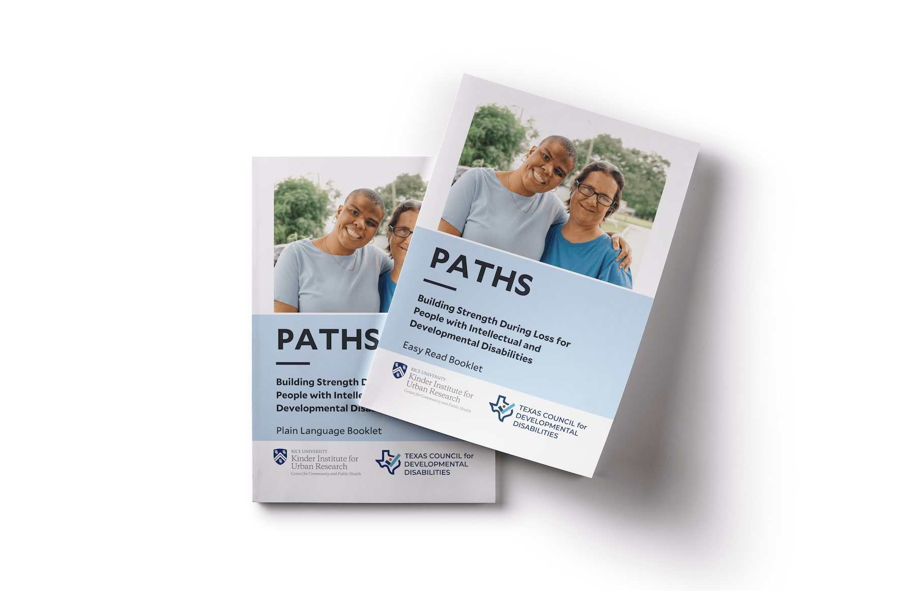 Two printed Paths booklets about building strength during loss for people with intellectual and developmental disabilities.