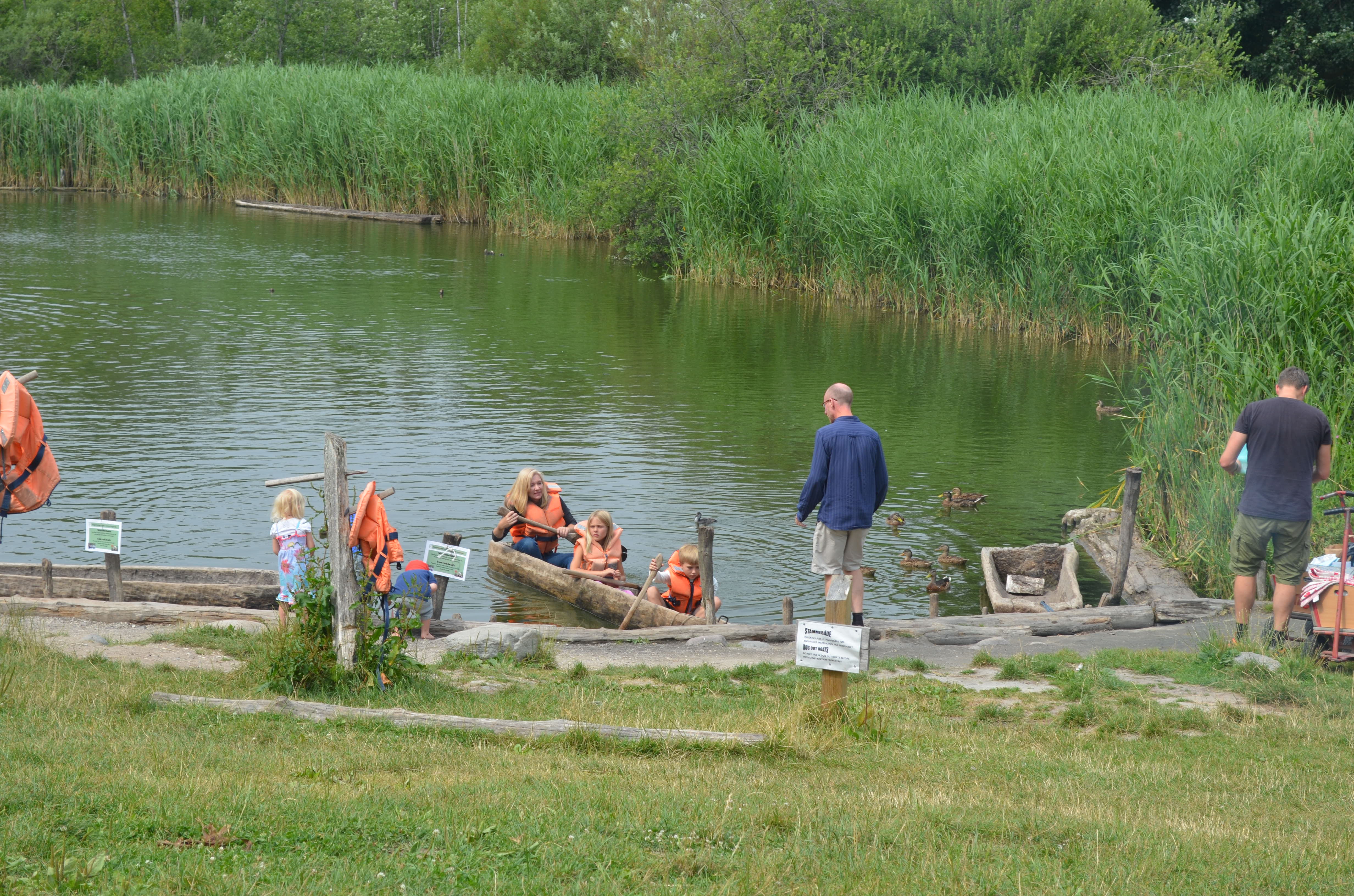 Paddling in a log boat.