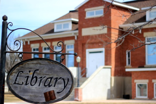 "Library" sign with the library in the background