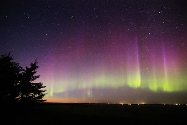 Aurora Borealis: vivid purple pillars above a green band