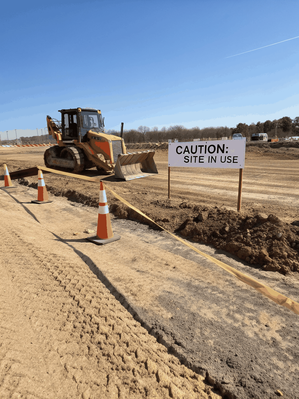 Heavy machinery performing site grading and preparation