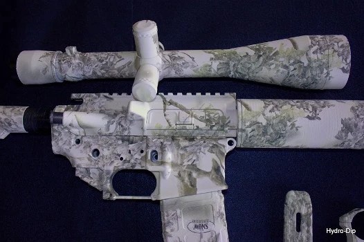 AR-15 receiver set with hydro-dipped camo pattern; visually striking film-transfer finish offering full-coverage aesthetics but limited abrasion and heat resistance.