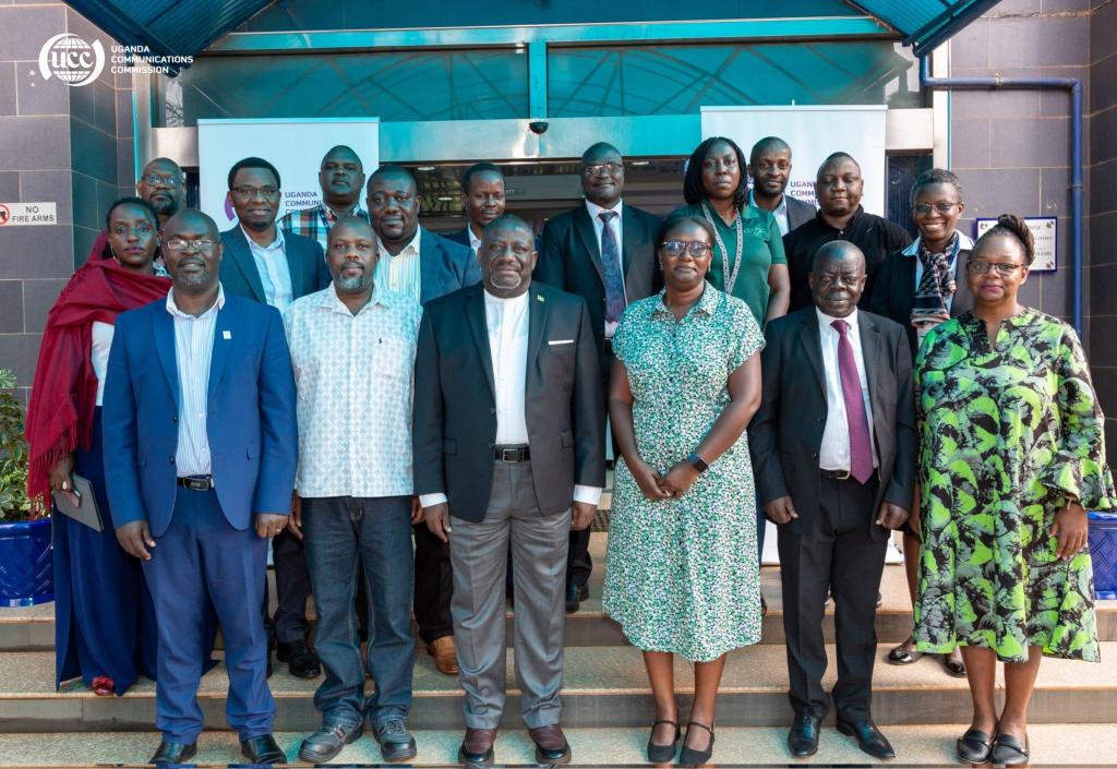 UCC Executive Director, Hon. Nyombi Thembo (3rd from left in front row) poses for a group photo with the newly introduced Artificial Intelligence Task Force. PHOTO: UCC/via X