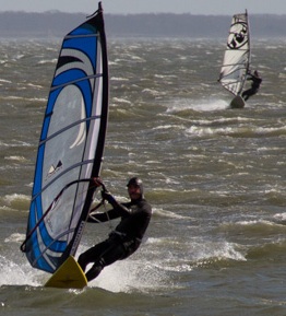 Two windsurfers