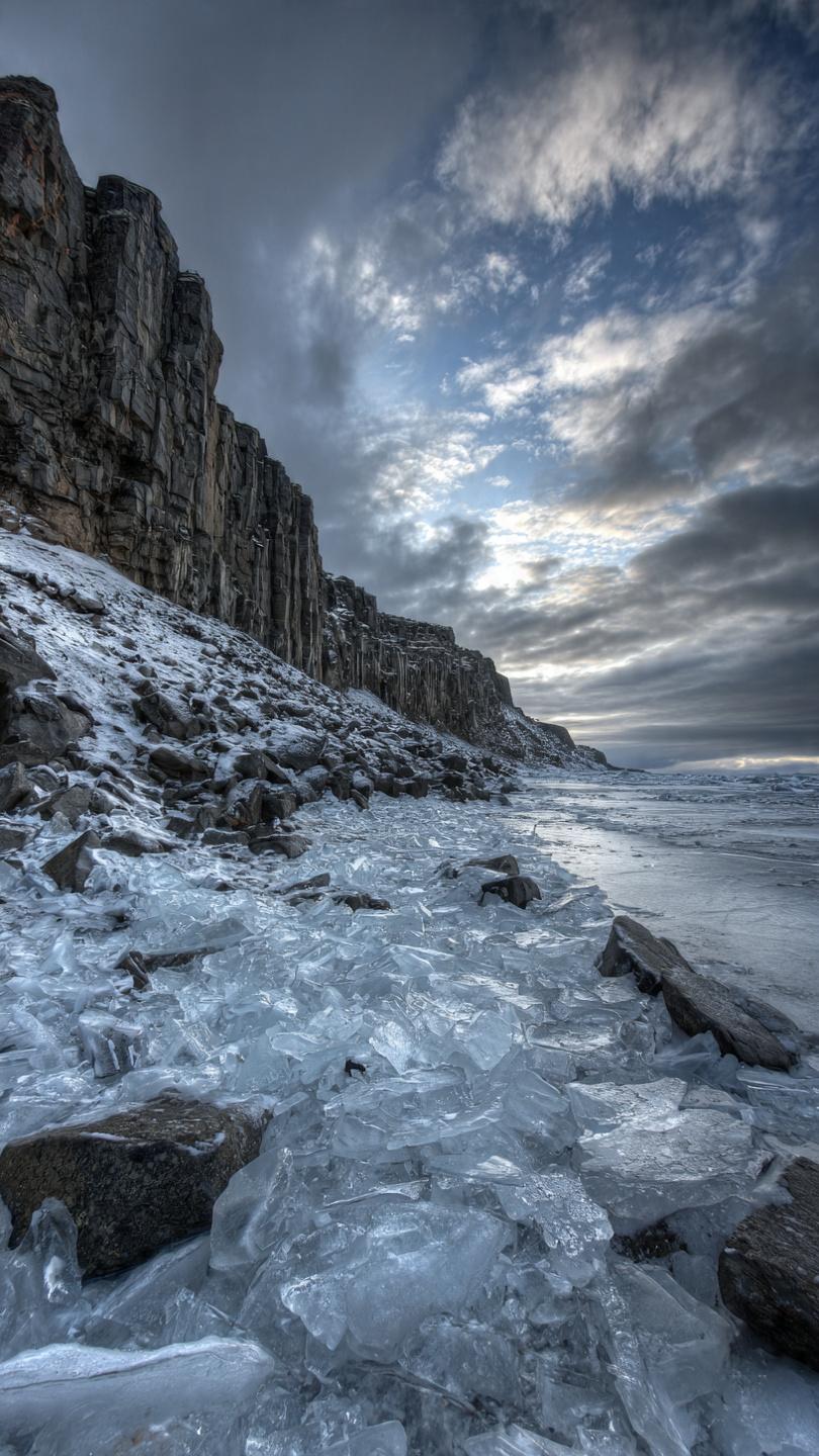 IMAGE SUGGESTION: The final Iceland image - ice chunks, basalt columns, dramatic sky