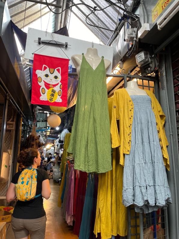Clothes hanging in the alleyways of the Chatuchak Weekend Market Bangkok Thailand