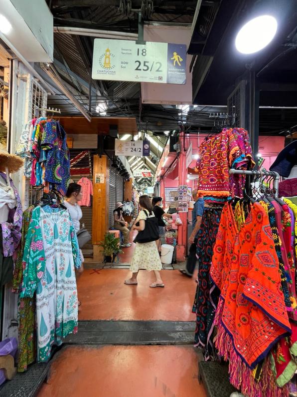 Clothes in an alleyway at Chatuchak Weekend Market Bangkok Thailand