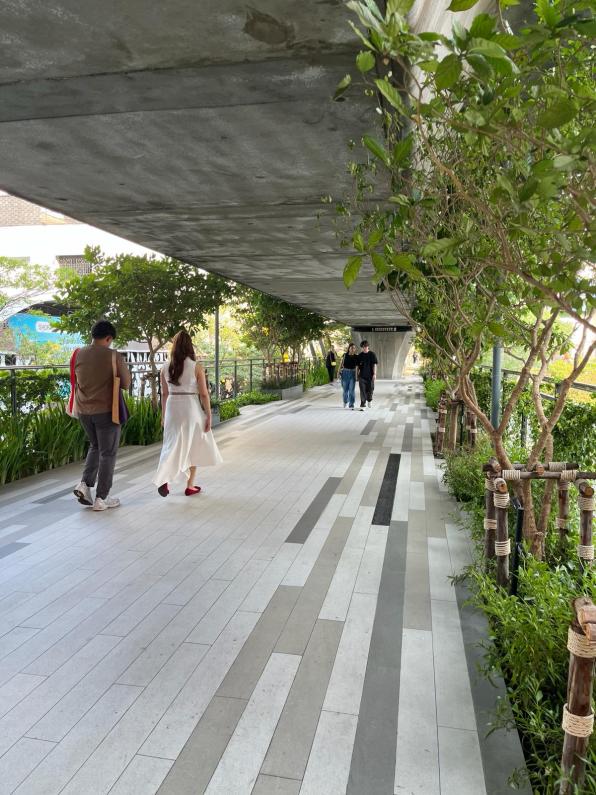 A walking underpass with green trees in Bangkok Thailand