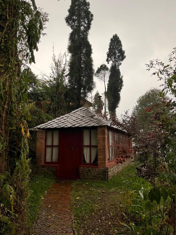 A cabin nestled in the woods at the Nagarkot Farmhouse in Nepal