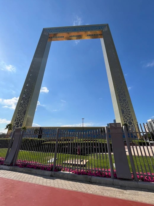 The golden Picture Frame Dubai standing tall against the blue skies.