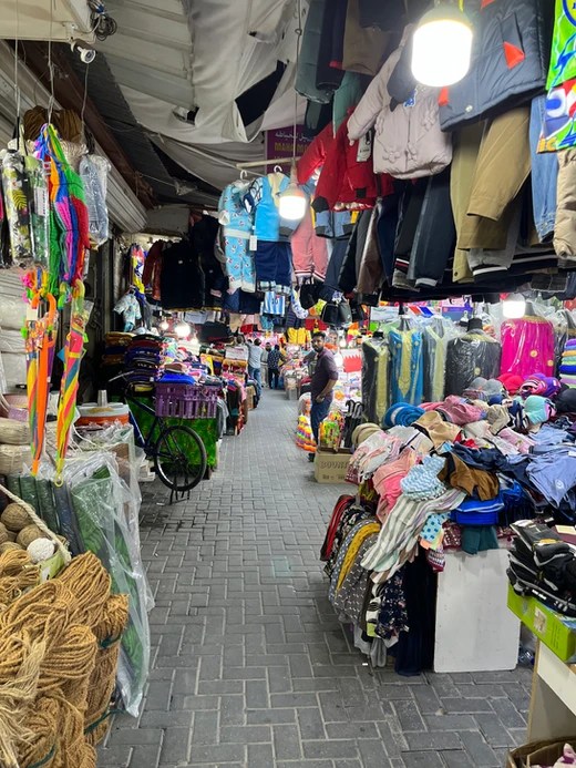 Clothes for sale in the alleyways of The Manama Souq, Bahrain.