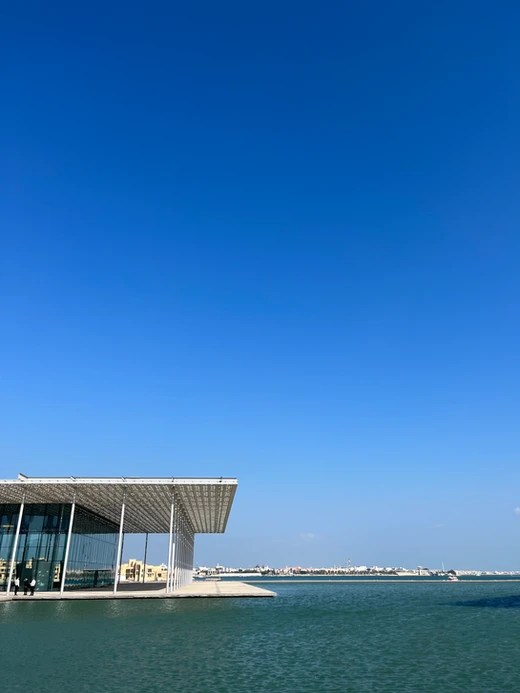 A view of the sky and water right outside the Bahrain National Museum